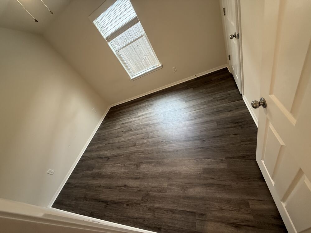 Close view of dark wood-look vinyl plank flooring