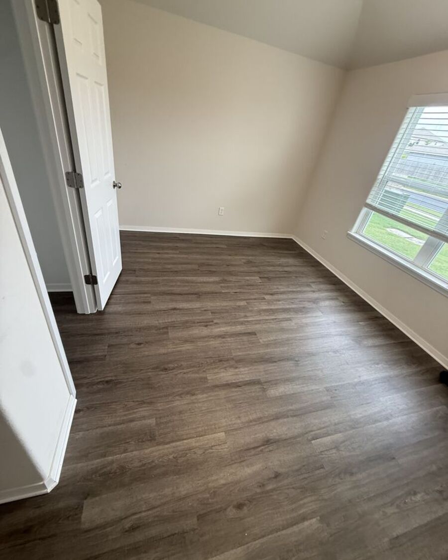 Dark wood-look vinyl plank flooring installed by Barbosa Flooring